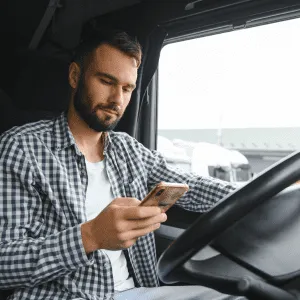 Contractor in a truck using a home improvement crm