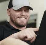 Man using integrations in the Leap CRM on tablet