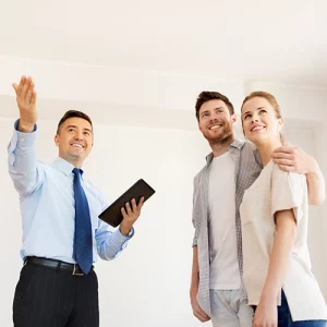 salesman and showing couple something