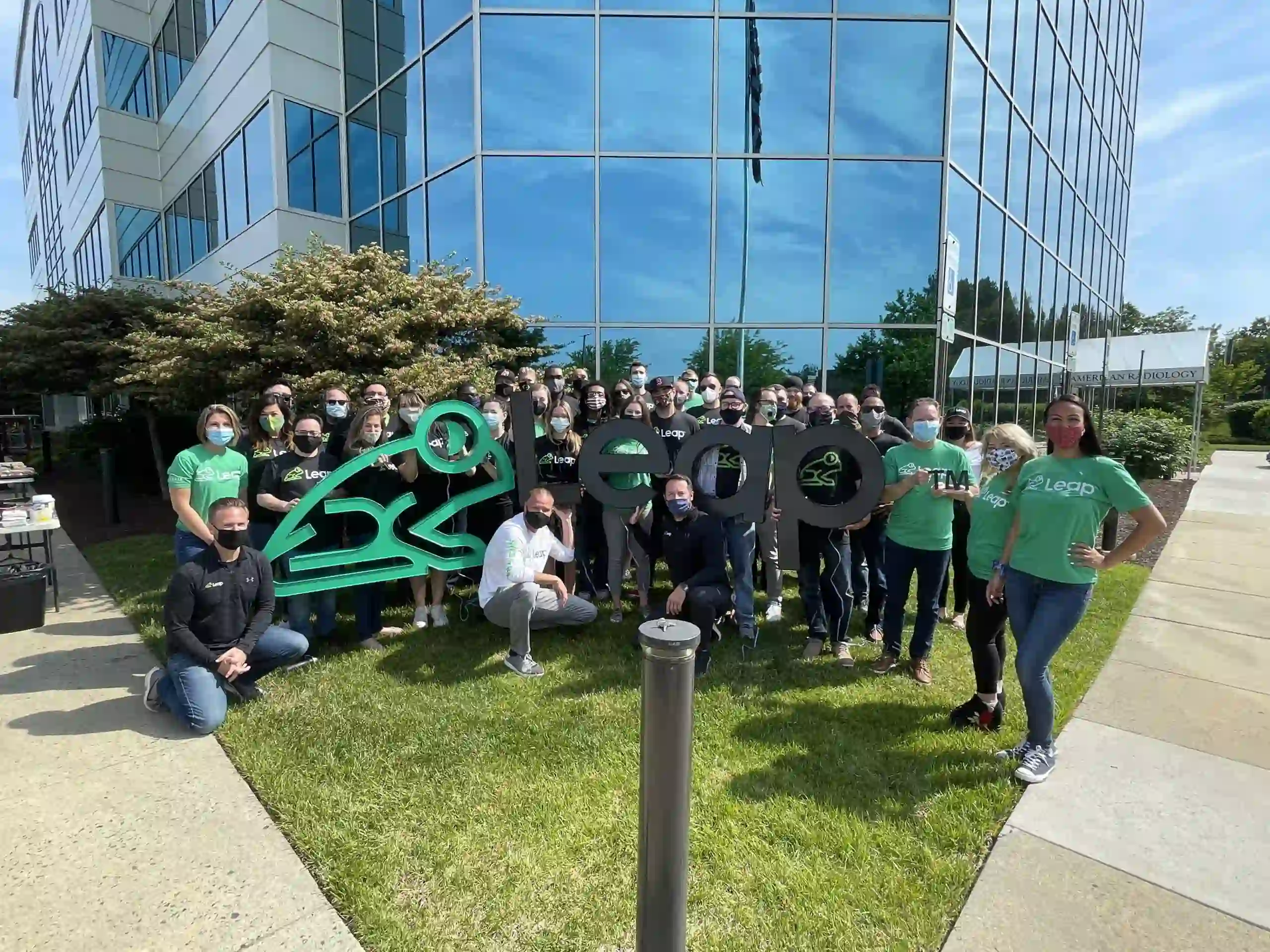 Leap employees standing in front of new office building