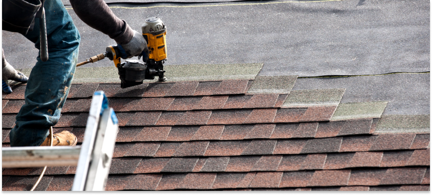 Working on a roof after learning how to estimate a roofing job