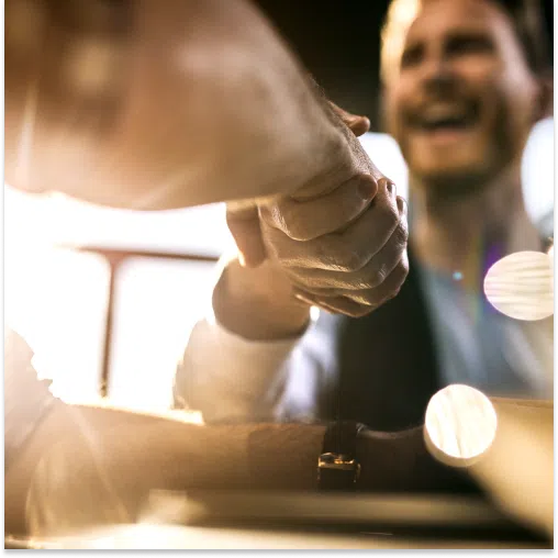 A roofing sales pitch leads to a handshake