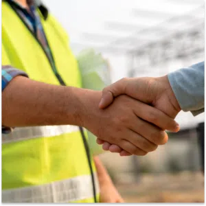 Shaking hands during the construction sales process