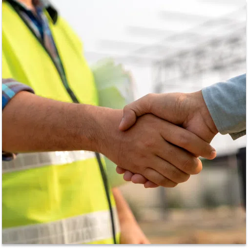 Shaking hands during the construction sales process